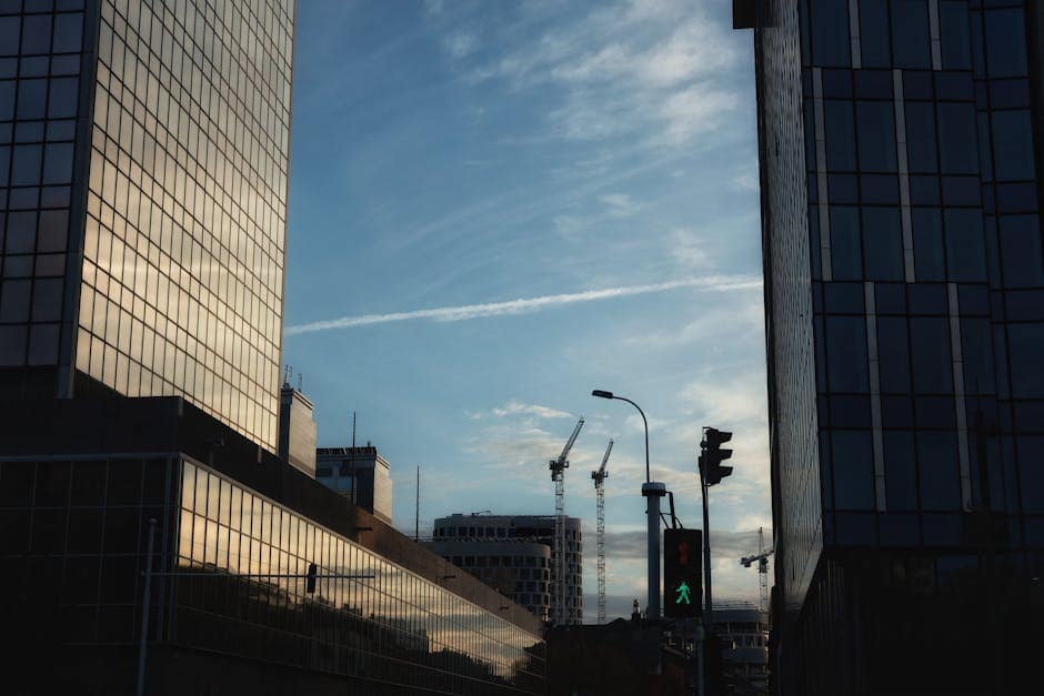 Skyline with modern office buildings in Brussels at sunset, showcasing urban development.