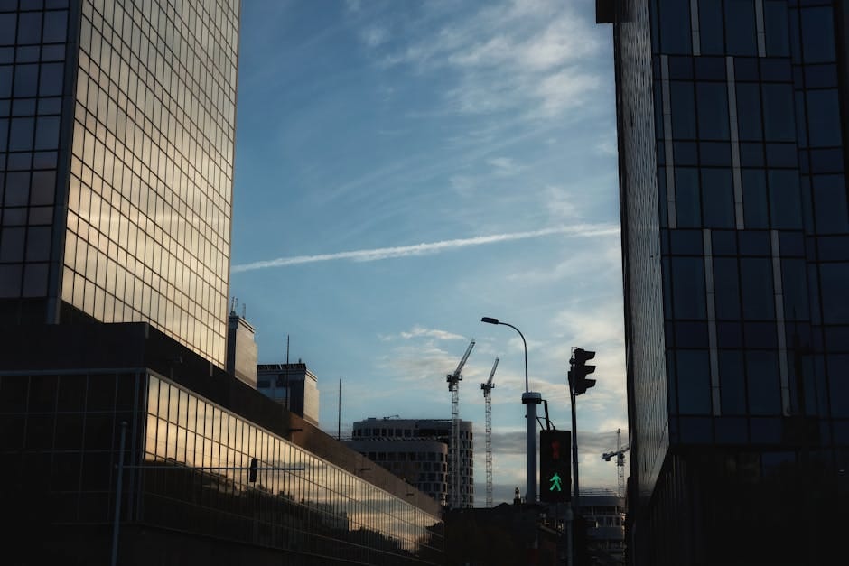 Skyline with modern office buildings in Brussels at sunset, showcasing urban development.