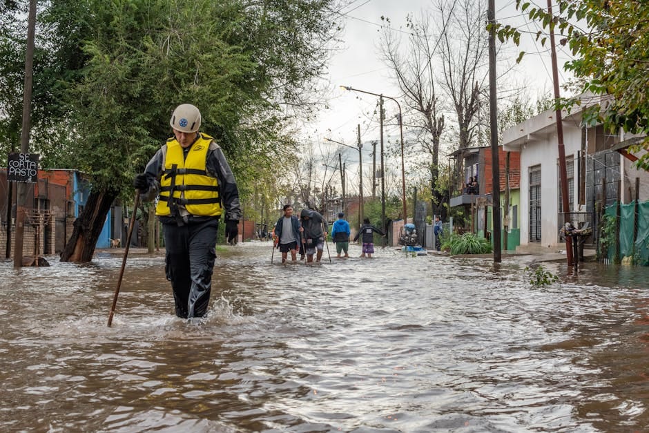 Rescue team evacuates flood victims in Buenos Aires. Humanitarian aid at work.