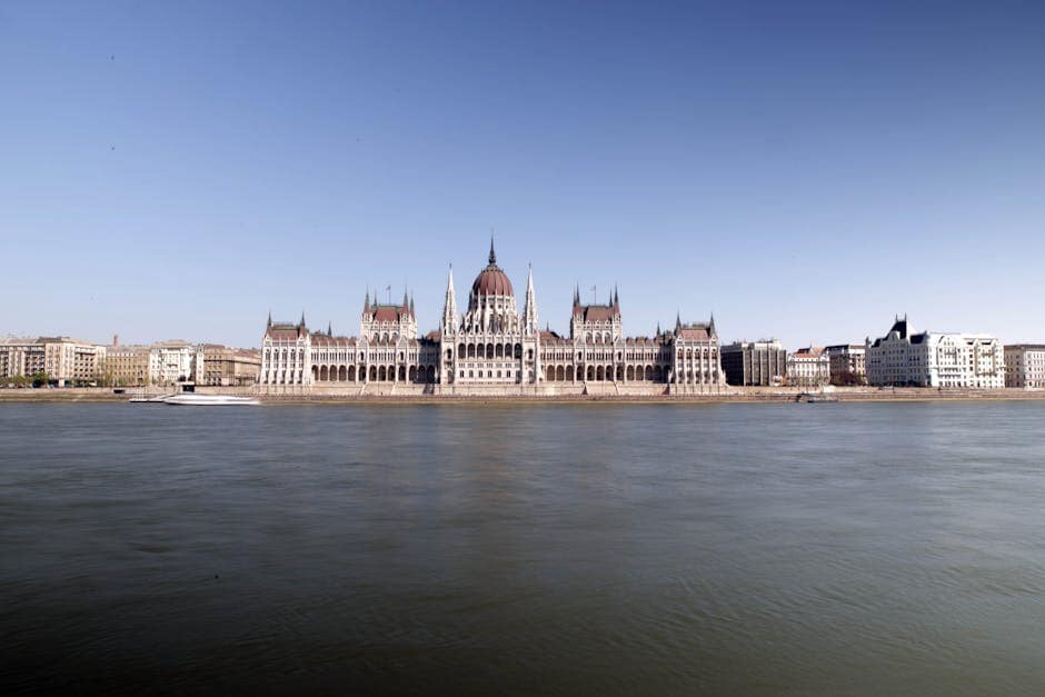 Panoramic view of the iconic Hungarian Parliament Building in Budapest overlooking the Danube River.