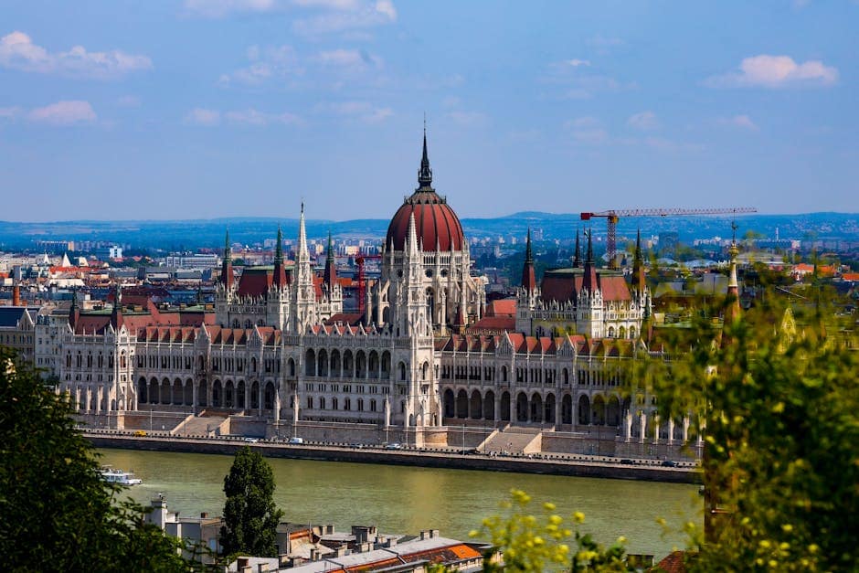 A breathtaking view of the iconic Hungarian Parliament Building on a sunny day in Budapest, Hungary.
