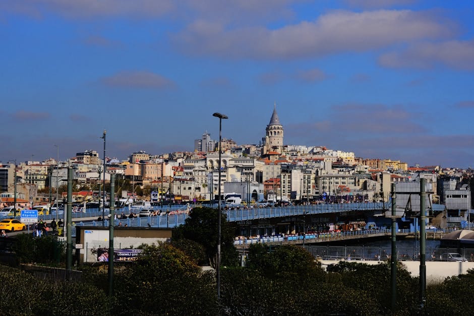 Stunning view of Galata Tower and Bridge in Istanbul against a vibrant cityscape.
