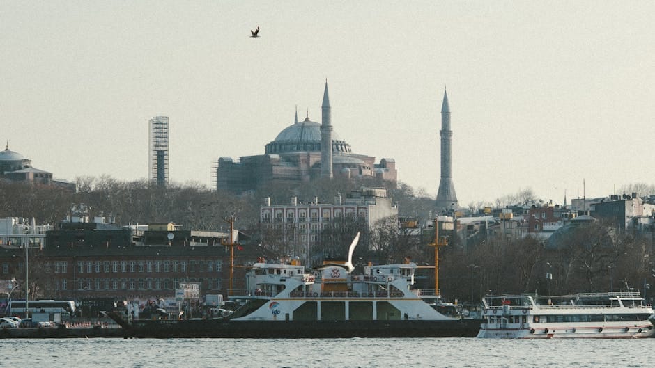 A picturesque view of the Hagia Sophia and boats on the Bosphorus in Istanbul.