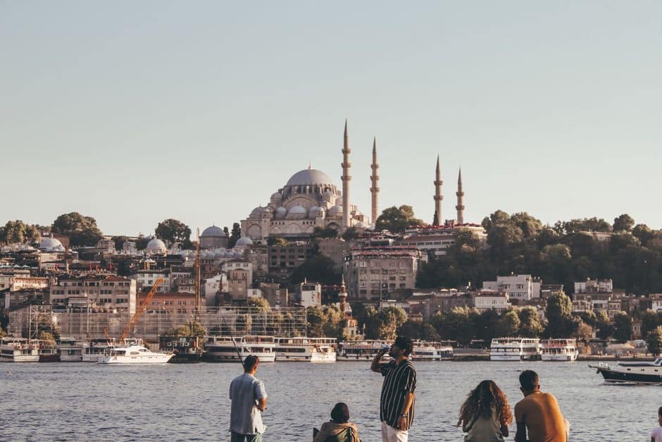 A stunning cityscape of Istanbul featuring the iconic Suleymaniye Mosque and bustling waterfront.