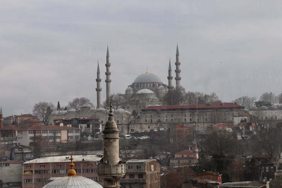 A striking cityscape of Istanbul featuring the iconic Suleymaniye Mosque in winter.