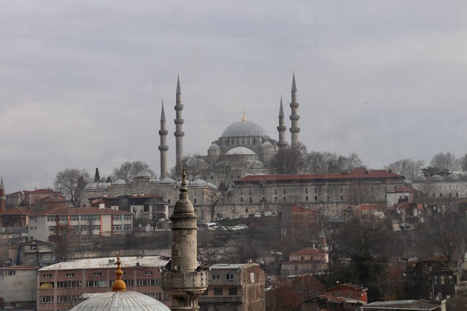 A striking cityscape of Istanbul featuring the iconic Suleymaniye Mosque in winter.