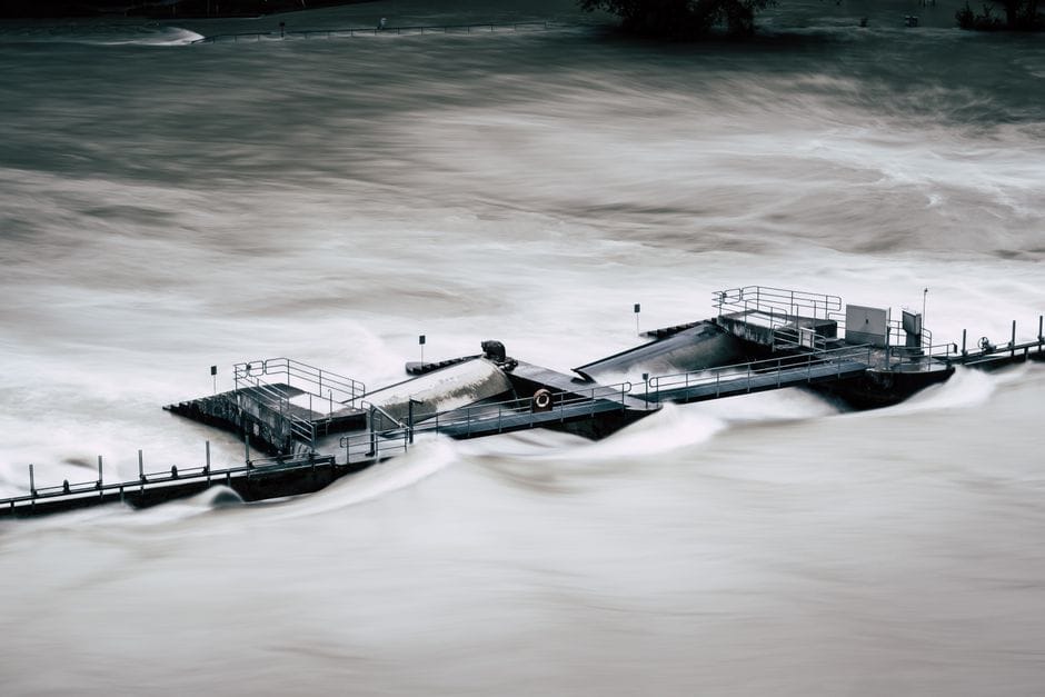 An aerial view of a structure overwhelmed by a river flood in Bern, Switzerland.