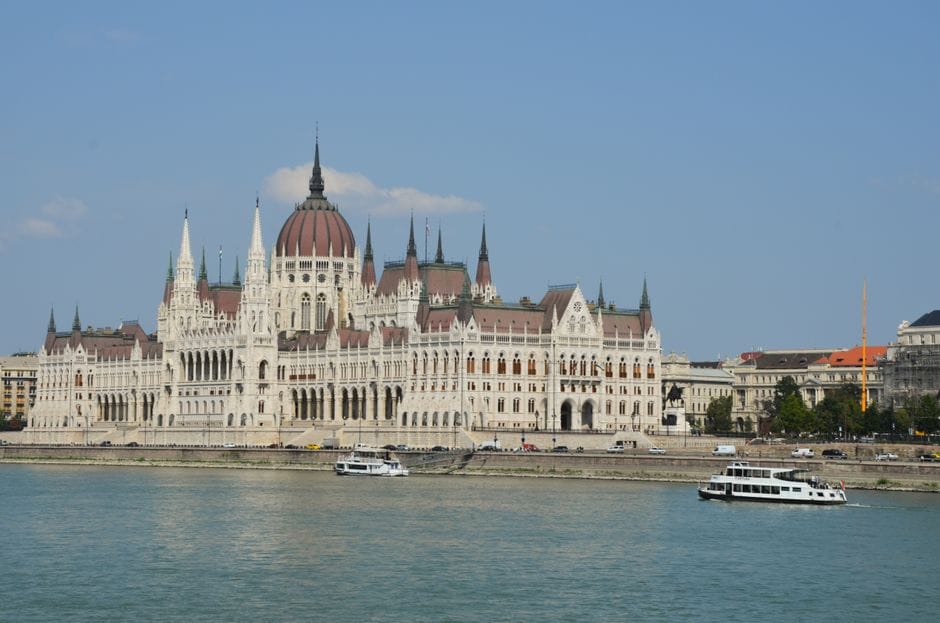 Majestic view of the Hungarian Parliament Building along the Danube River in Budapest.