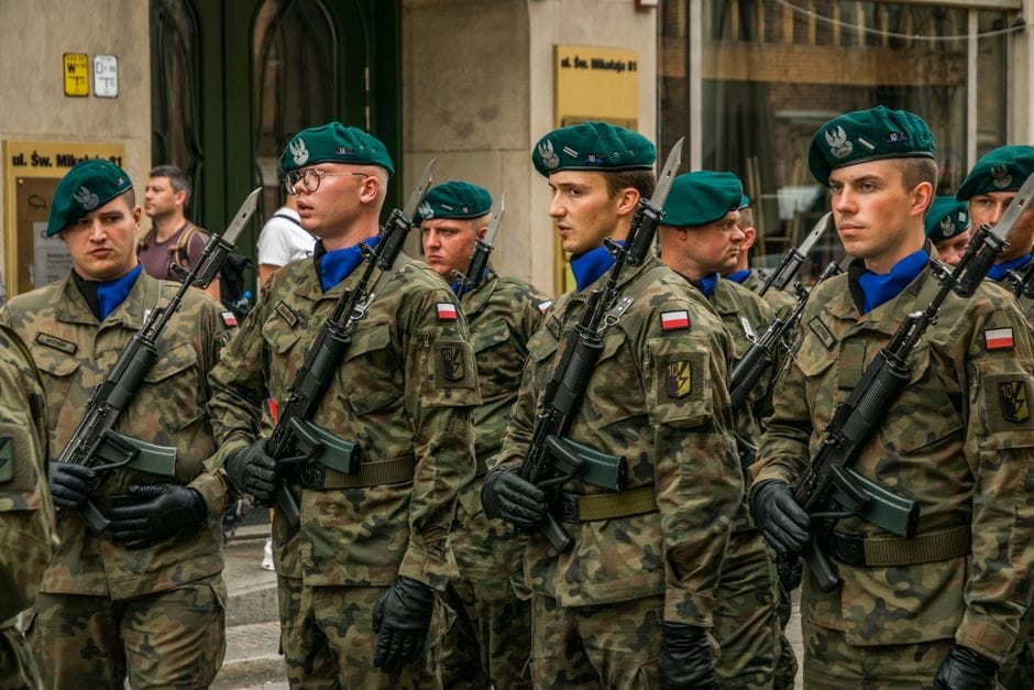Polish soldiers in camouflage uniforms during a military parade in Wrocław, Poland.