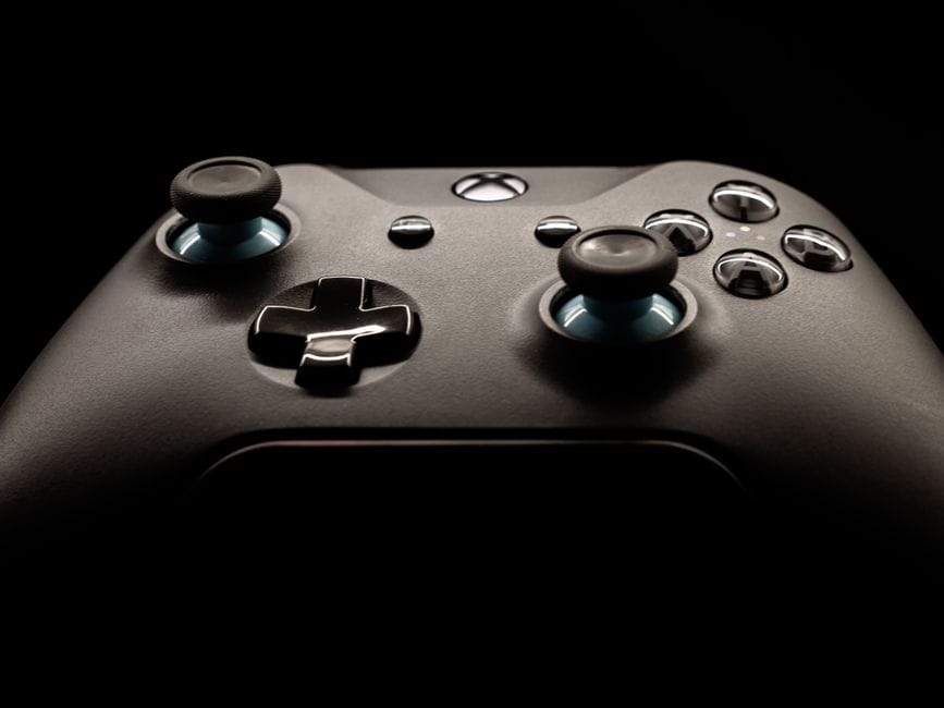A detailed close-up of a modern gaming controller highlighting its design and functionality.